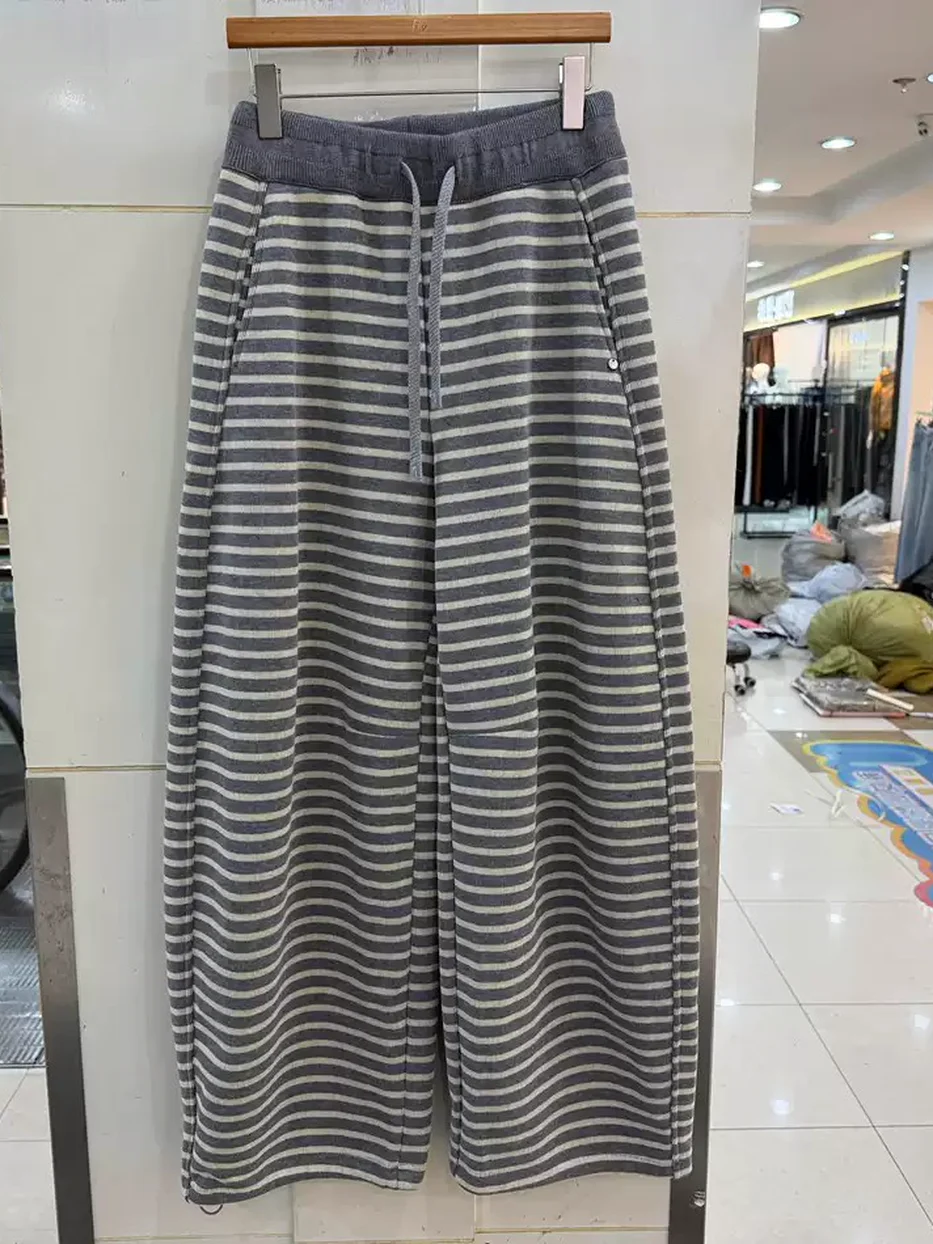 Women's drawstring curved-leg trousers · 98059
