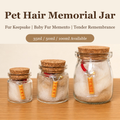 Close-up of glass memorial jar with pet hair and cork stopper
